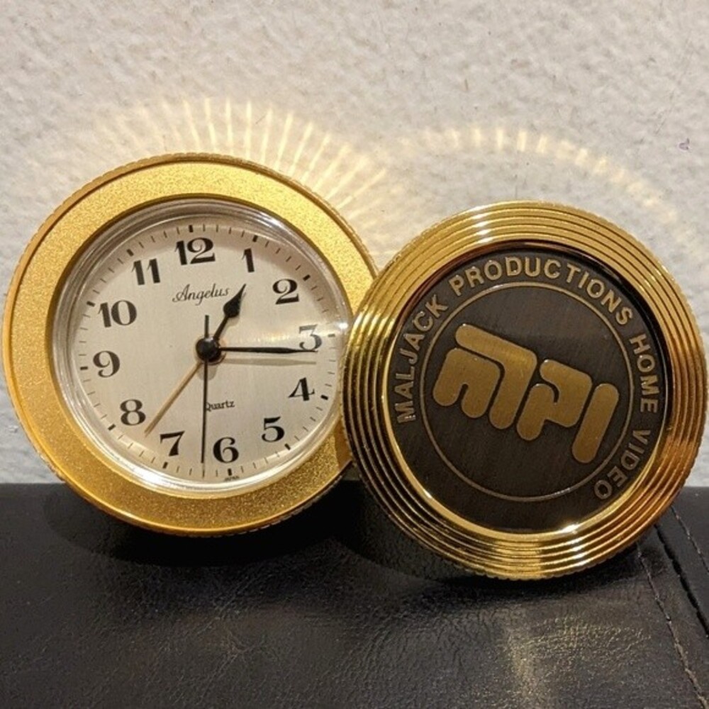 Angelus metal clock vintage 1980s Maljack Productions Home Video Motion Company
